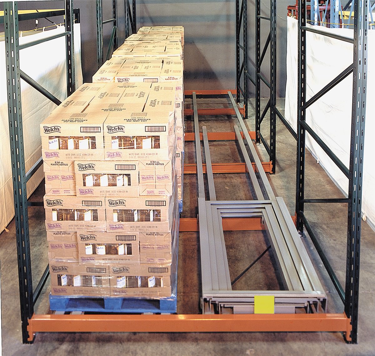 Push-back cart-on-rail storage system