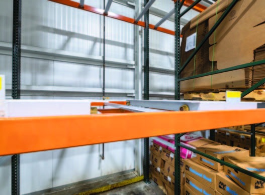 Push-back pallet rack storing Midwest Kitchens products